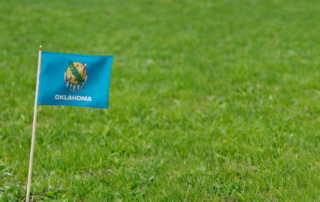 Golf Green with Oklahoma state flag.