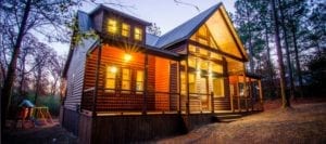 The outside of Lazy Daze cabin at dusk.