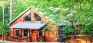 The wood two-story cabin with two outside decks.