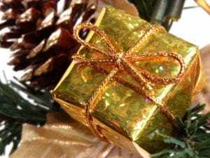 a gold foil-wrapped gift with gold ribbon.