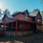 A large two-story Creative Escapes rental cabin.