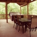large table and chairs on the covered porch.