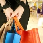 business woman in a shopping centre with some bags