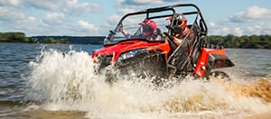 ATV driving through water.