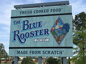 The Blue Rooster sign. Text: "Fresh Cooked Food," est 2012, "Made from Scratch."