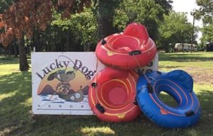 Lucky Dog Resort sign and inflatable 1-person floats.