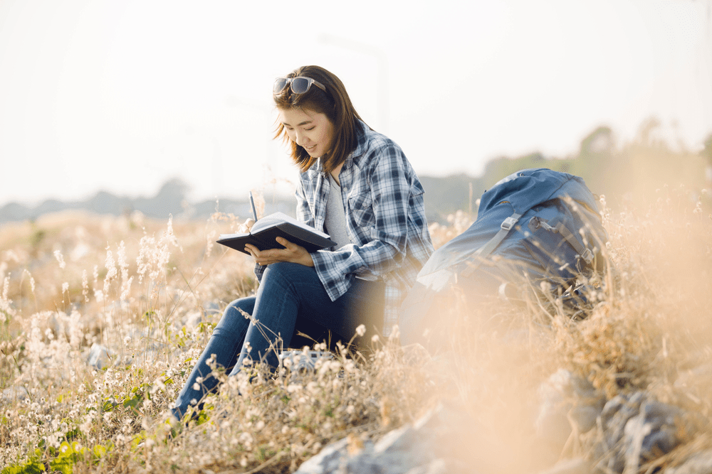 Picture of a woman taking advantage of her retreat cabin's location.