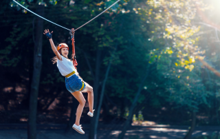 Picture of woman on a zipline in Broken Bow.