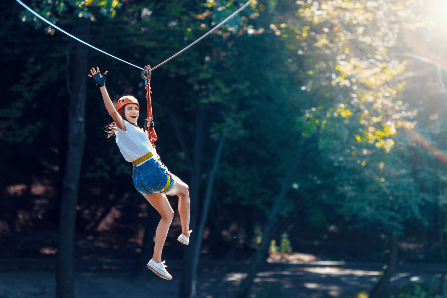 Picture of woman on a zipline in Broken Bow.