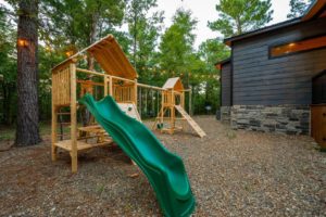 A photo of a playset to enjoy at a cabin rental after exploring Broken Bow attractions. 