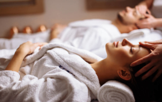 A couple enjoying their massage at a Broken Bow spa.