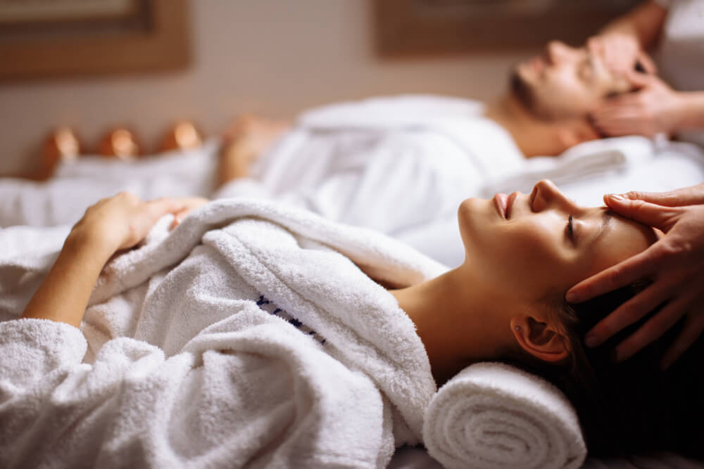 A couple enjoying their massage at a Broken Bow spa.