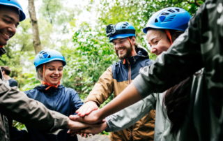 A group enjoying the activities available to those who plan cabin getaways in Oklahoma as a corporate retreat.