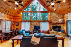After exploring outdoor things to do in Oklahoma, relax in a cozy living room at a Broken Bow cabin rental.