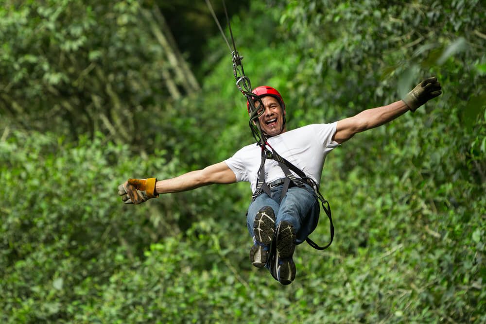 Someone ziplining in Broken Bow, one of the many outdoor things to do in Oklahoma.