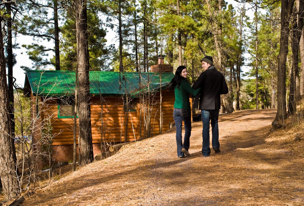 A couple walking back to one the top romantic cabins in Broken Bow.