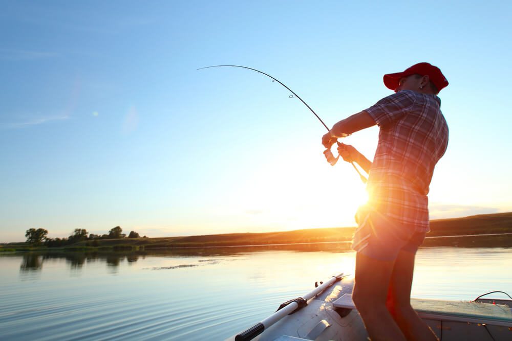 A man out fishing with one of the local guides in Broken Bow, OK.