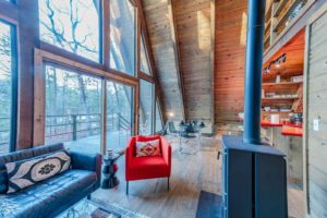 A cabin rental in Broken Bow with floor to ceiling windows, perfect for taking the scenery in.