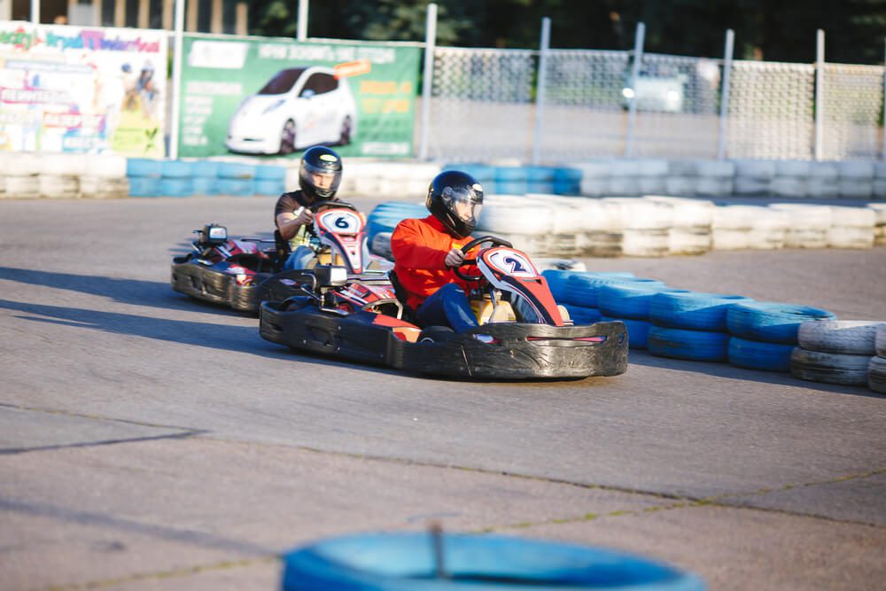 Two people racing go-karts in Broken Bow.