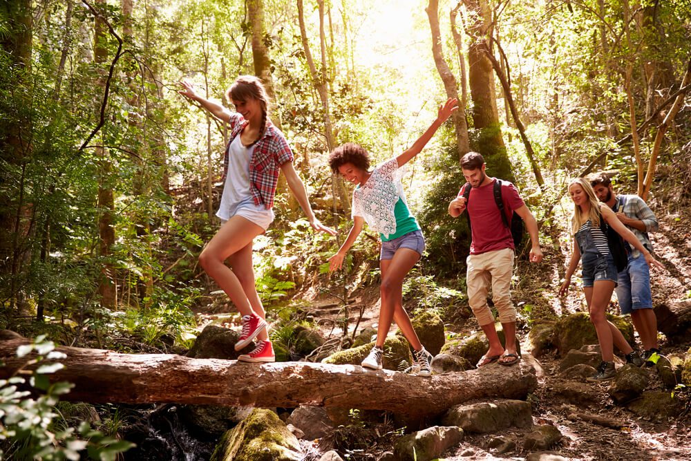 A group hiking along a trail found when researching what to do in Broken Bow.