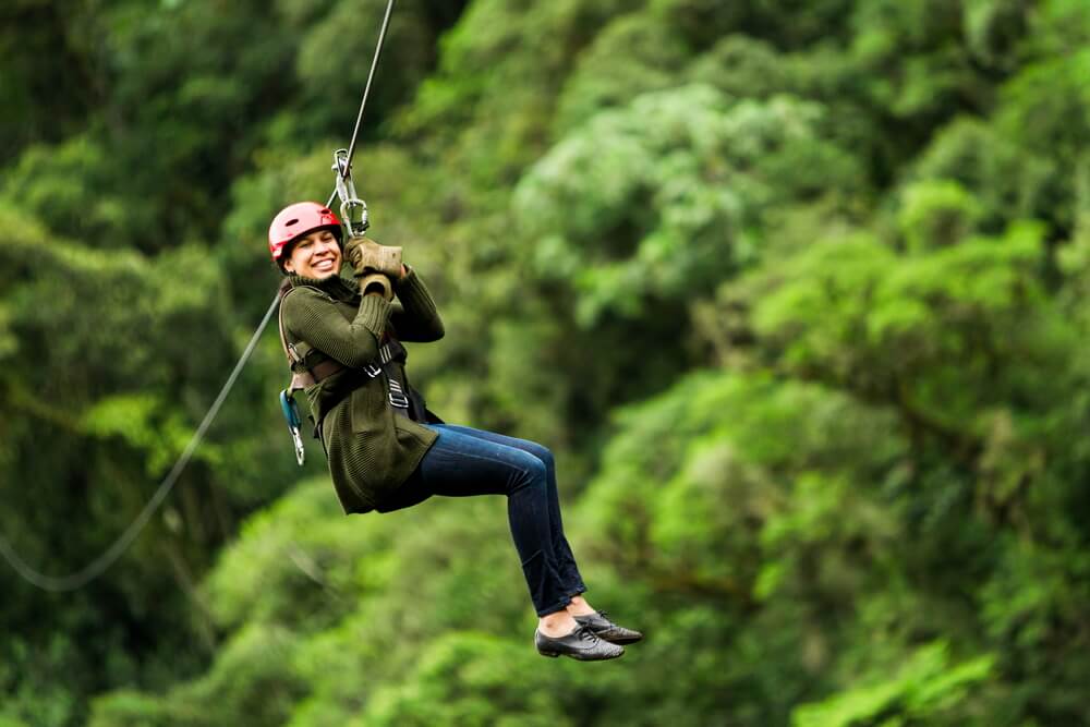 A photo of a woman ziplining in Broken Bow.