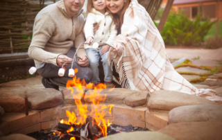 A family making s'mores, one of the must-do things to din Broken Bow, Oklahoma.