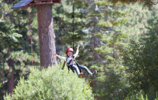 A kid ziplining on his Oklahoma spring break getaway.