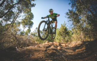 A man biking along one of the mountain biking trails in Broken Bow.