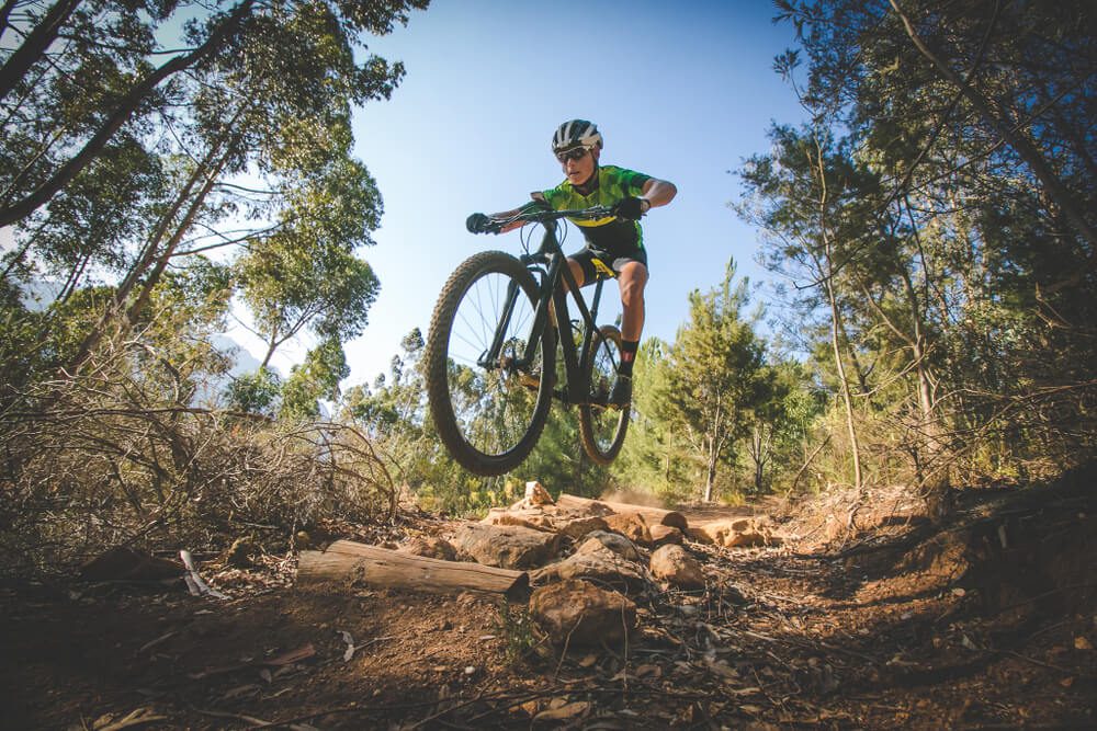 A man biking along one of the mountain biking trails in Broken Bow.