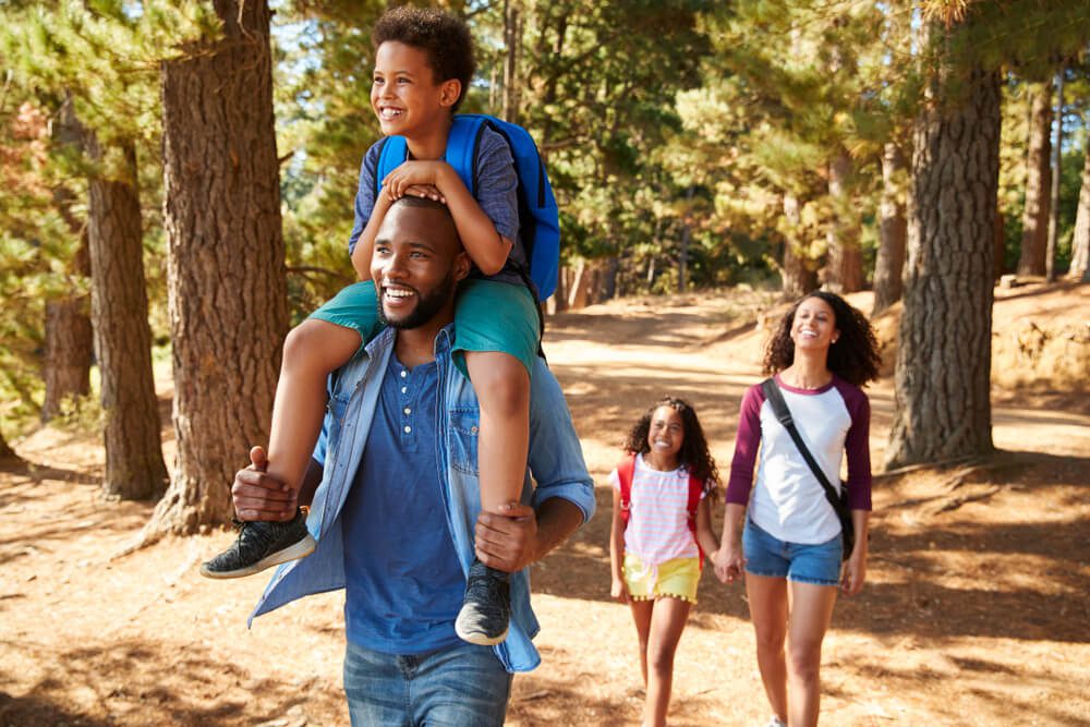 A family out hiking, one of the top outdoor activities in Broken Bow.