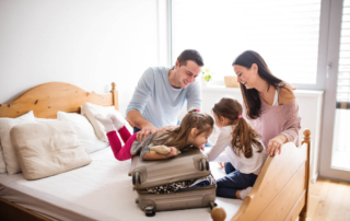 A family packing for their stay at a Hochatown cabin.