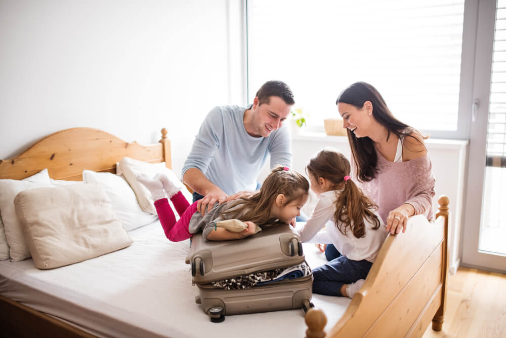 A family packing for their stay at a Hochatown cabin.