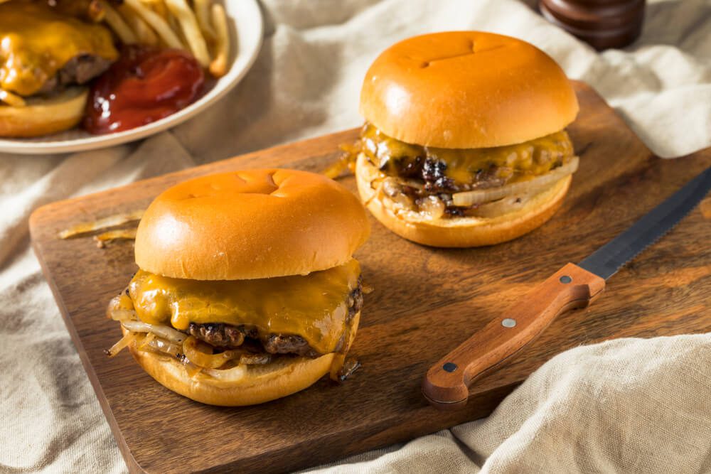 Two Oklahoma onion burgers, one of the popular recipes you can make on vacation.