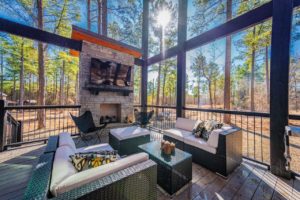 The back deck of a Broken Bow cabin rental to enjoy wine from a local winery on.