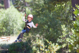 A kid ziplining, one of the best activities in Hochatown.