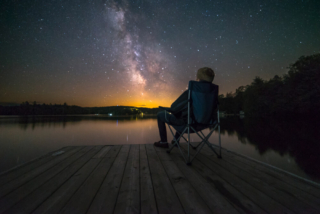 A person out at one of the best "stargazing near me" spots near Hochatown.
