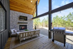 The back deck of a Broken Bow, Oklahoma, rental to see fall foliage from.