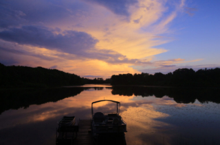 An Oklahoma sunset over a lake in Hochatown.