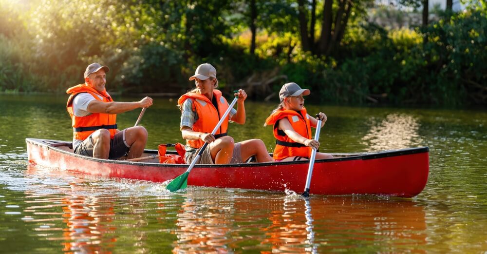 A family kayaking, one of the best outdoor activities to enjoy in Oklahoma.