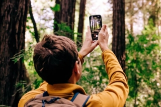 A person taking photos on their phone in Hochatown, Oklahoma.